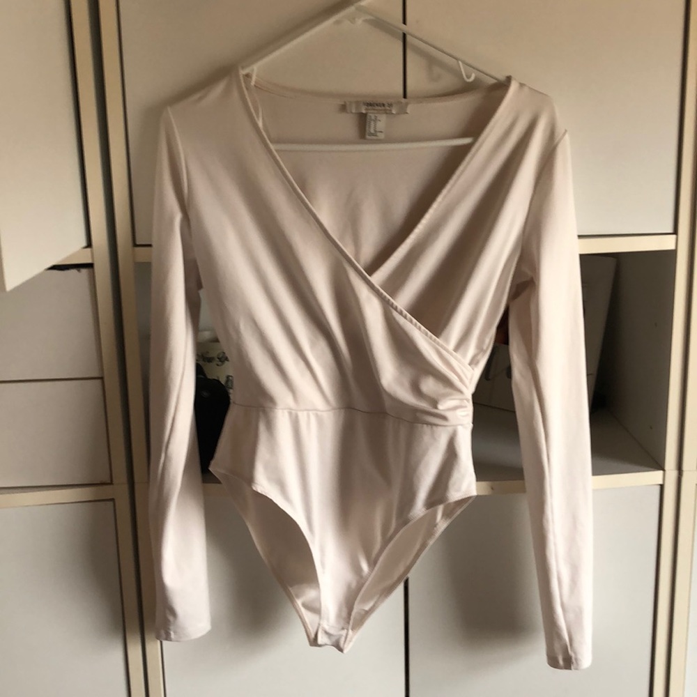 cream colored body suit